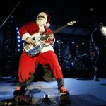 PARK CITY, UT - DECEMBER 20: The Red Hot Chilli Peppers perform before the superpipe finals of the Chevy Truck U.S. Snowboard Grand Prix on December 20, 2002 in Park City, Utah. (Photo by Jed Jacobsohn/Getty Images)